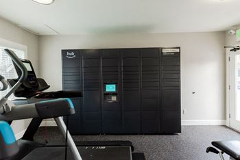 A gym with a reformer and a door to a closet